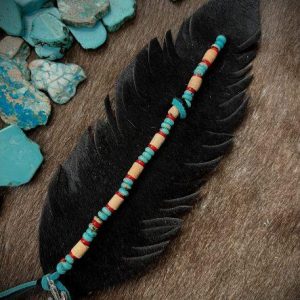onyx color with hair on hide and red faux turquoise and wood beads