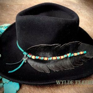 onyx color with hair on hide and red faux turquoise and wood beads on black cowboy hat