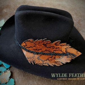 cognac python patterns on a black cowboy hat with black braids