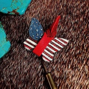 leather butterfly small and hand painted in red, white and blue with antique gold pushpin.
