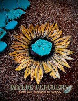 yellow and gold sunflower with dark brown center and turquoise how lite