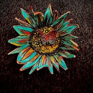 Turquoise blue, yellow, dark brown and green with butterfly on a sunflower design and a antique gold stick pin.