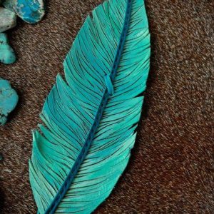 leather feather hat band with shades of turquoise and a teal deerskin lace