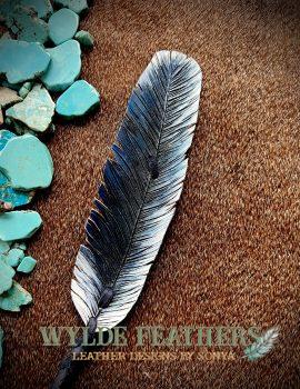 blue, white and black feather that that looks like the ocean