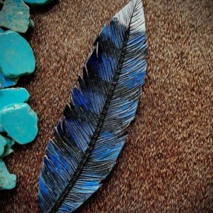 Blue, white and black jaybird feather with black lace stitching