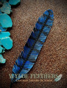 blue jay feather that is blue and black with black lace