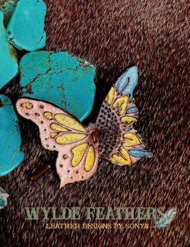 leather butterfly with light blue, yellow and gold sparkles.