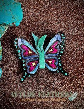Turquoise, violet, periwinkle and fuschia colored leather butterfly
