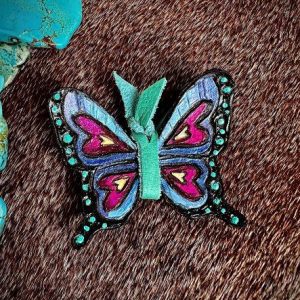 Turquoise, violet, periwinkle and fuschia colored leather butterfly