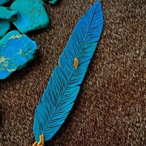 leather feather hat band painted teal with blue turquoise and mustard colored saddle tan lace