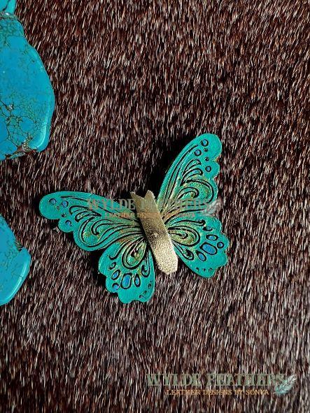 leather butterfly pin that is hand painted turquoise green and gold